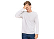 © Krakenimages.com - Handsome caucasian man wearing casual white sweater smiling and laughing with hand on face covering eyes for surprise. blind concept.