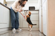 © Yakobchuk Olena - Owner feeding dog at the kitchen