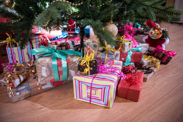 Wall Mural - Gifts on the floor under the Christmas tree.