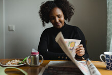 Woman Reading Newspaper, Sweden