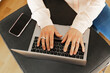 © Johnér - Hands typing on laptop keyboard, Sweden