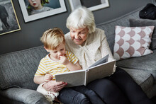 Grandmother Reading Book To Grandson, Sweden