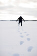 © Johnér - Person walking through snow, Sweden