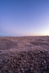 Sticker - 
Landscape of the beach from the sand in autumn at sunset.