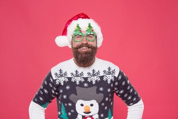 Wall Mural - santa guy in hat and party glasses like his favorite winter sweater having fun on new year holiday, happy new year