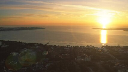 Wall Mural - Gelendzhik Sea Bay aerial bird view from above, beautiful sunset over resort city at black sea, drone point of view.