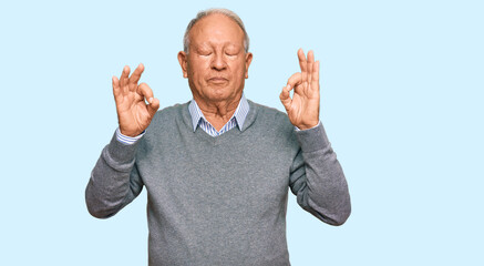 Canvas Print - Senior caucasian man wearing casual clothes relax and smiling with eyes closed doing meditation gesture with fingers. yoga concept.