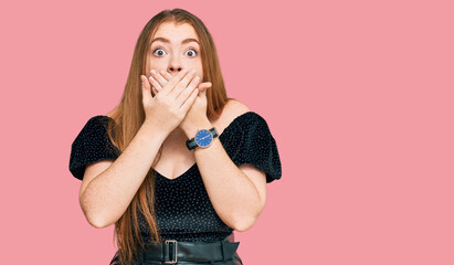 Wall Mural - Young beautiful redhead woman wearing elegant clothes shocked covering mouth with hands for mistake. secret concept.