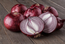Red Onions On Rustic Wood