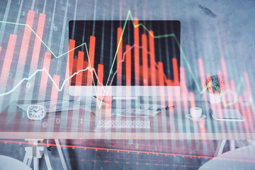 Multi exposure of financial graph drawing and office interior background. Concept of market analysis.