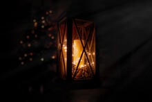 Close-up Of Illuminated Candle In Lantern At Night