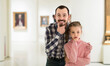 © JackF - young european father and daughter looking at paintings in halls of museum