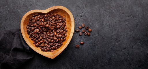 Canvas Print - Roasted coffee beans in heart shaped bowl