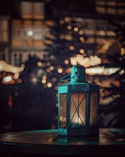Close-up Of Lantern On Table At Night