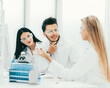 © yurolaitsalbert - team of scientists discussing something at the Desk