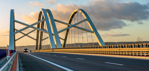 Wall Mural - Modern construction highway bridge at sunset