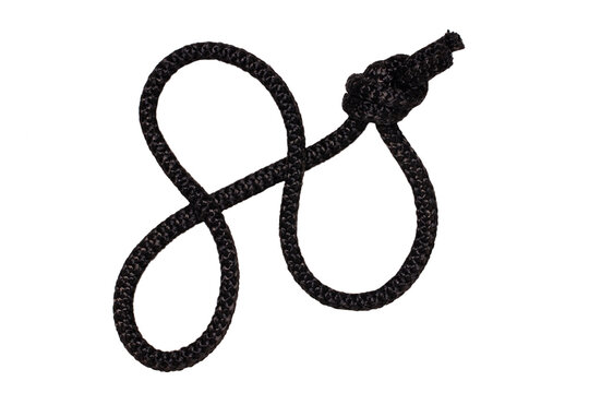 Rope isolated. Closeup of black rope with knot, isolated on a white background. Navy, marine and angler node.