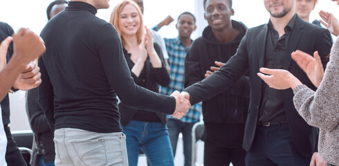 Wall Mural - group of happy young people applauding their leaders