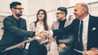 © yurolaitsalbert - business partners shaking hands after discussing a new contract.