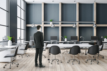 Wall Mural - Businessman standing in luxury conference interior