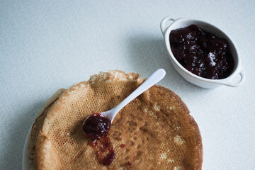 pancakes on a plate with jam, background, breakfast