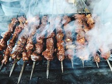 High Angle View Of Meat On Barbecue Grill