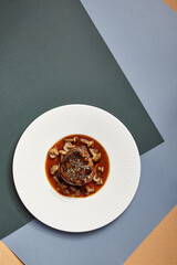 Canvas Print - Filet mignon served with mushrooms top view