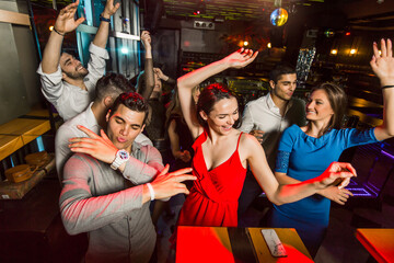 Young people dancing in night club