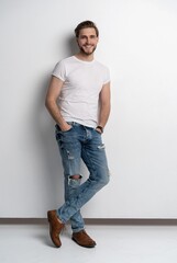 Sticker - Full length studio portrait of casual young man in jeans and shirt. Isolated on white background.