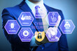 © Elnur - Cybersecurity concept with businessman pressing button