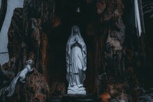 Statue Of Virgin Mary On Rock Formation
