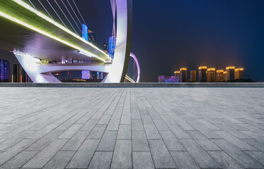 Poster - Empty plaza floor and Nanjing Eye Pedestrian Bridge in Nanjing, China