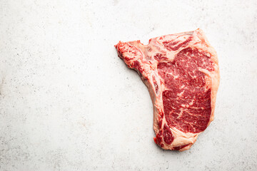 Wall Mural - Raw fresh meat T-bone beef Steak on white background, top view