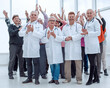 © ASDF - doctors and a group of mature people applaud
