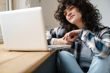 Attractive young woman working on computer