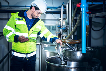 Wall Mural - Caucasian engineer man, or technicians are Checking the operation of the boiler equipment, In the beverage production industry, to people and engineering concept.