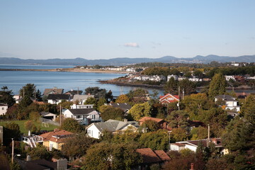 View of a small town with residential houses and harbor view at coast of Vancouver Island  near Victoria, British Columbia, Canada