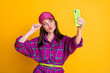 © deagreez - Photo of attractive person take selfie lips kiss arm touch hat wear purple plaid isolated on yellow color background