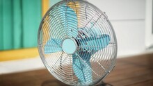 Close-up Of Electric Fan On Table