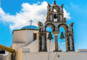 Wall Mural - A church bell tower in the village of Pyrgos, Santorini in summertime