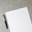 © Stanislav - Template of white paper with a ballpoint pen on light grey concrete background. Concept of new idea, business plan and strategy, empty space for text