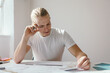 © Jodie Johnson/Austockphoto - Man frowning and deep in thought at work