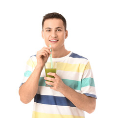 Poster - Young man with wheatgrass juice on white background