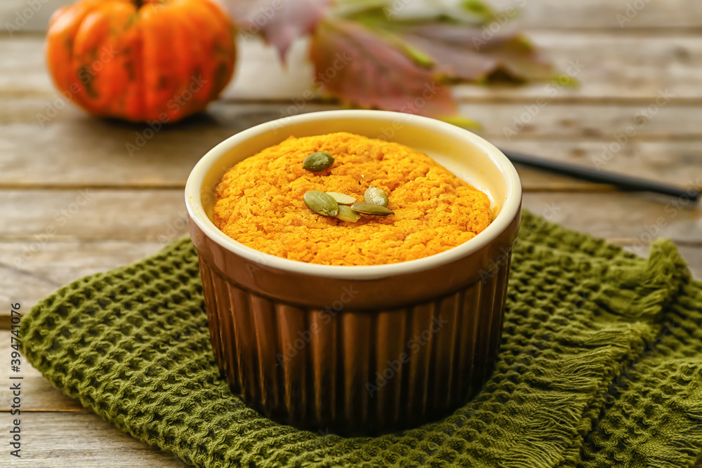 Tasty pumpkin pudding on table
