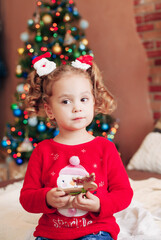 little girl in christmas interior