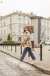 © Mila - Young woman wearing stylish trendy plaid shirt. Casual outfit. Street style fashion
