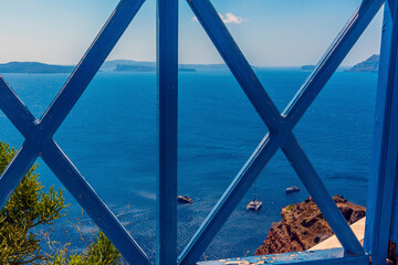 Wall Mural - A view from the village of Oia, Santorini out into the caldera in summertime