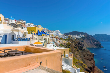 Wall Mural - The caldera with the white-capped  village of Oia, Santorini in summertime