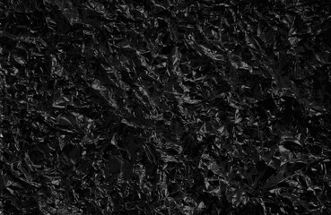 Wall Mural - Black crumpled foil texture background