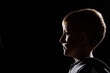© alexxndr - Backlit portrait of a child.